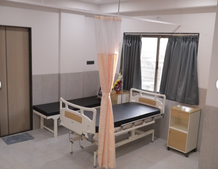 Patient ward with beds at New Life Hospital
